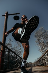 Dynamic drone footage capturing an athlete in motion during training.