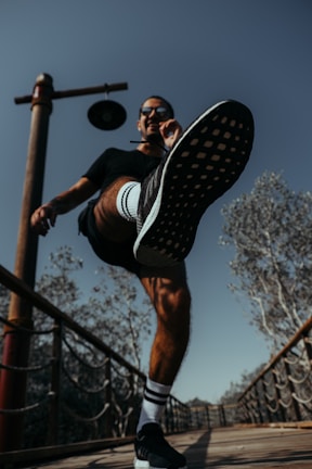 Action shot of Nacho Morel delivering a powerful kick during a competition.