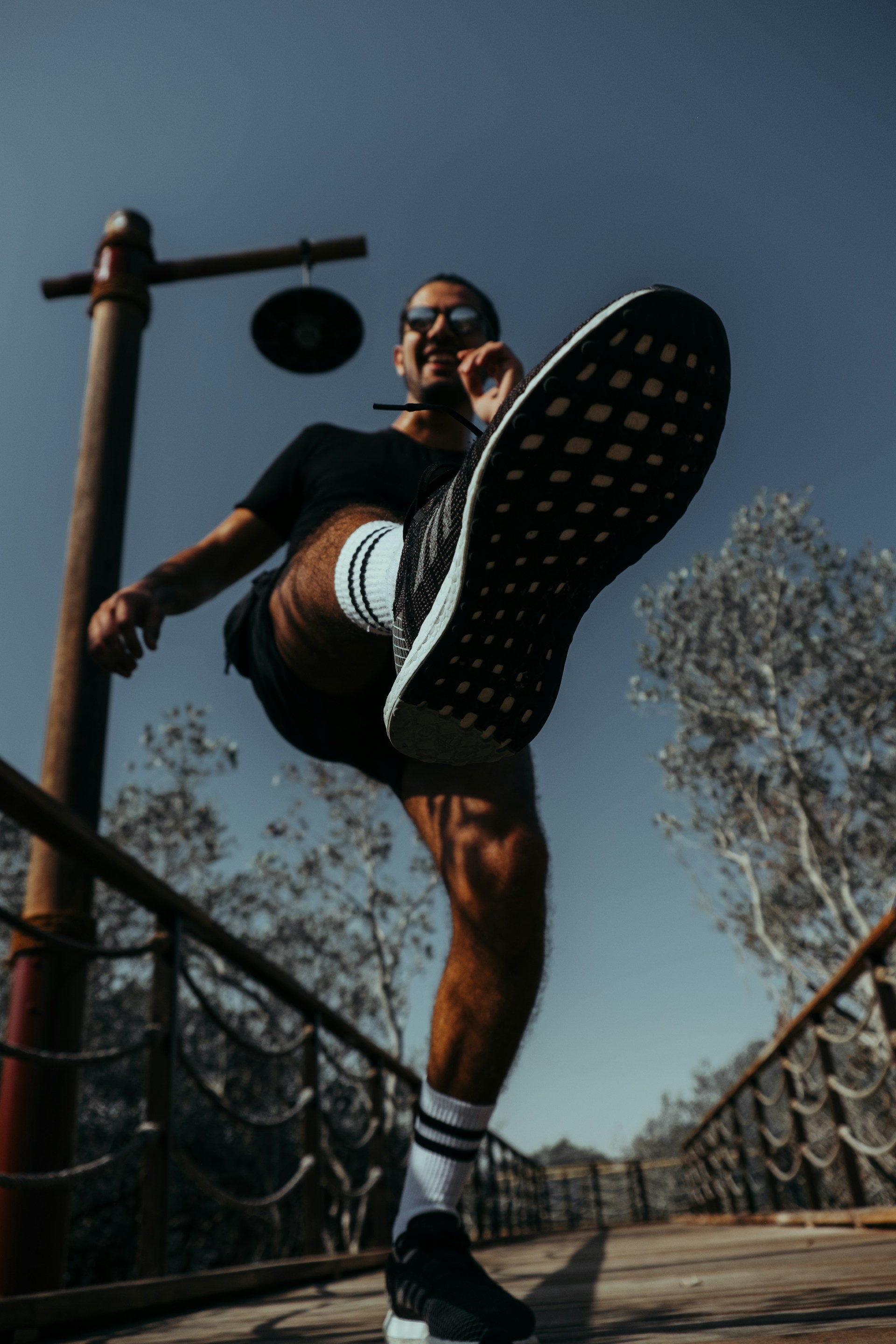 woman wearing yellow long-sleeved dress under white clouds and blue sky during daytime