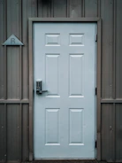 white wooden door with black door lever