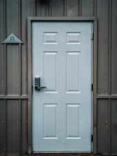 white wooden door with black door lever