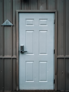 white wooden door with black door lever