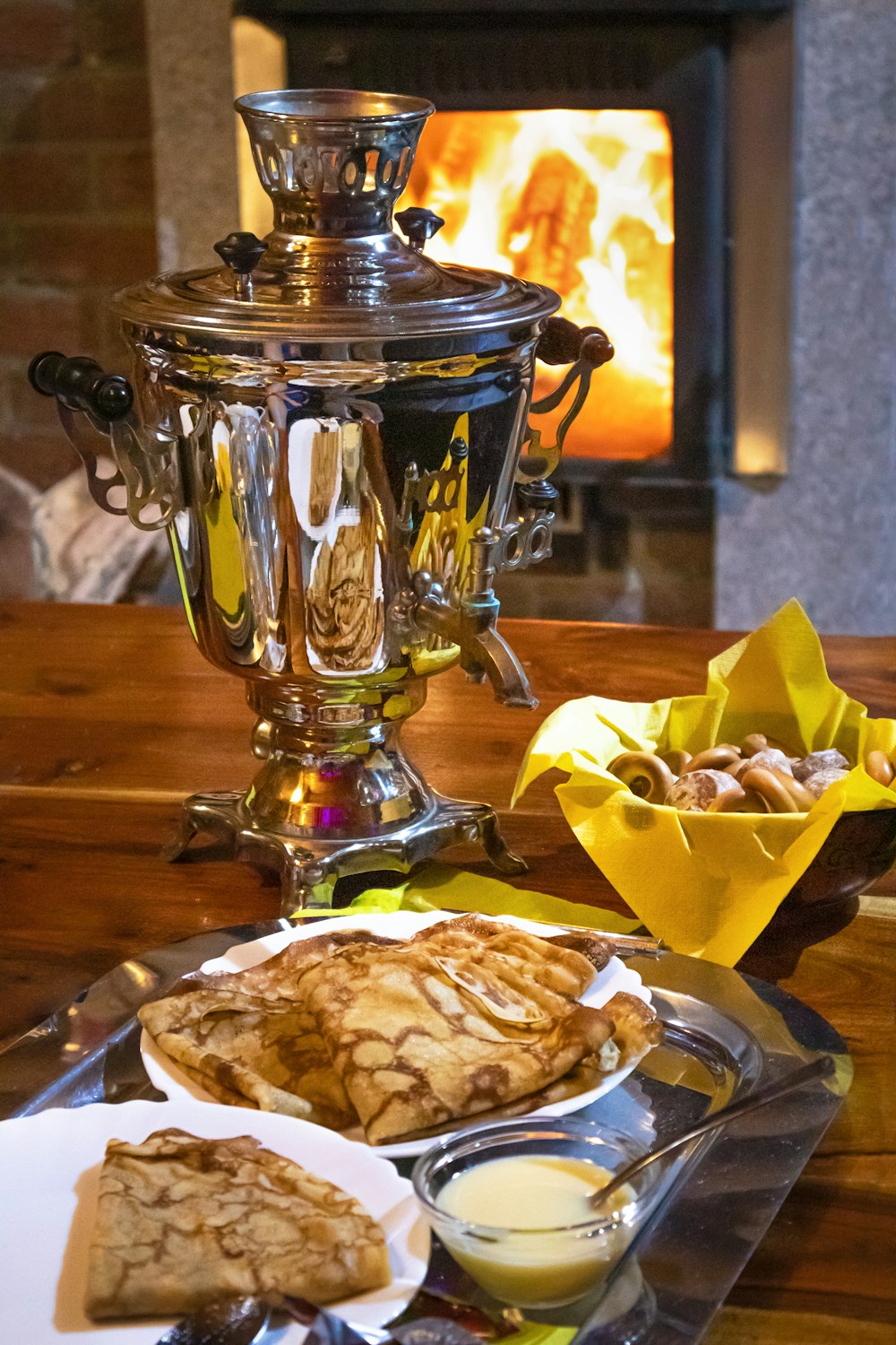 stainless steel container with bread on white ceramic plate