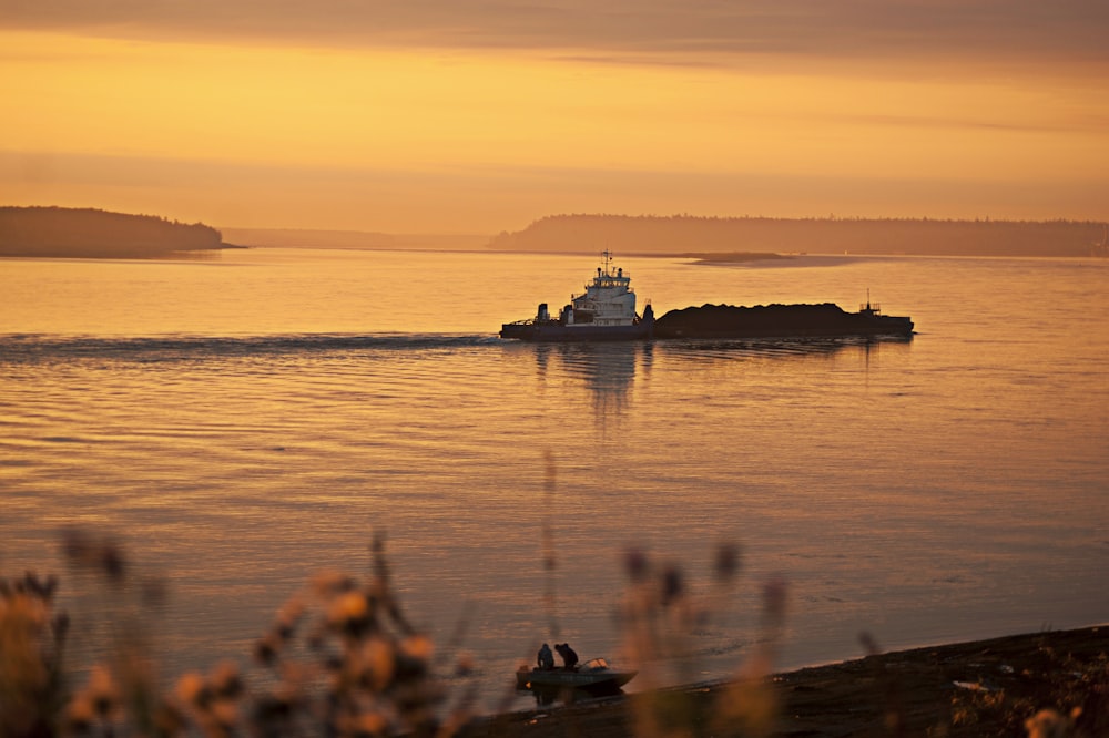 silhouette of people on boat during sunset