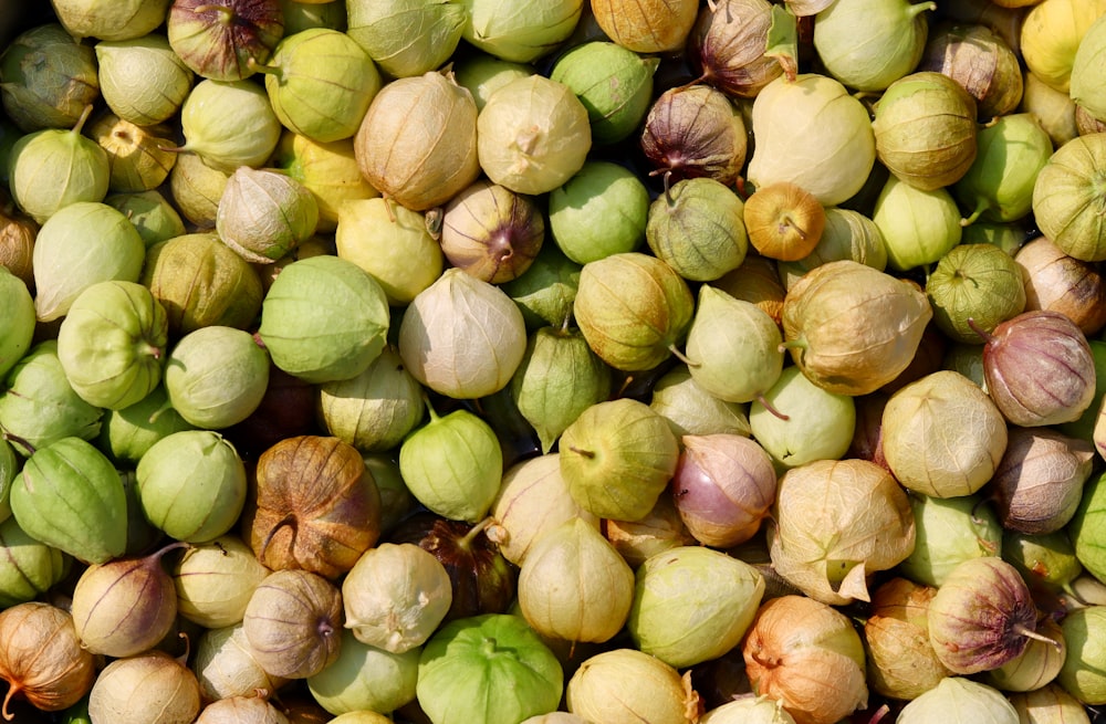 green and brown round fruits