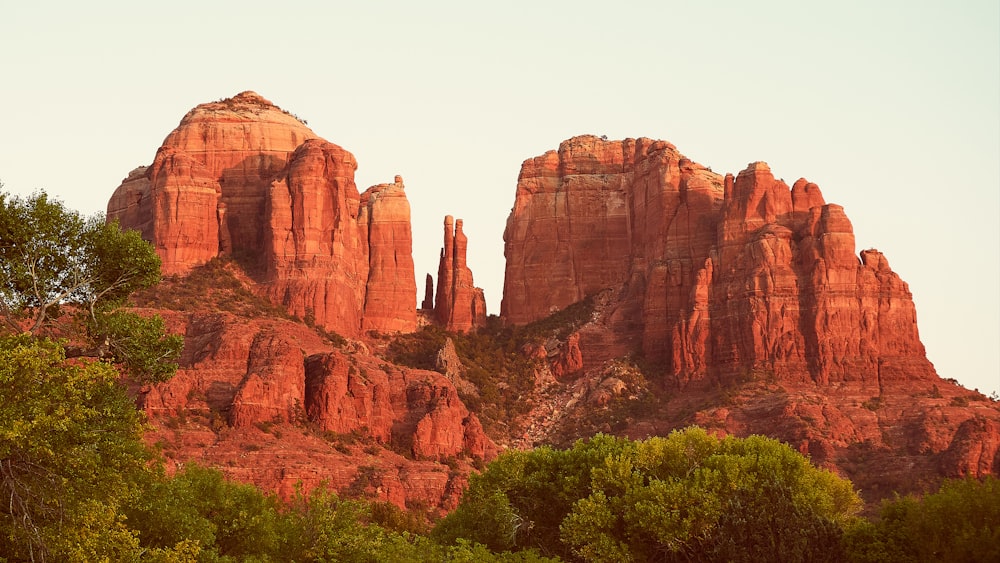 brown rock formation under white sky during daytime