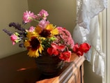 An elegant ceramic vase filled with fresh flowers.