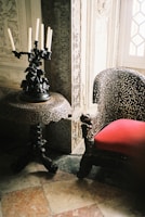 A beautifully carved royal table with intricate details in a cozy living room.