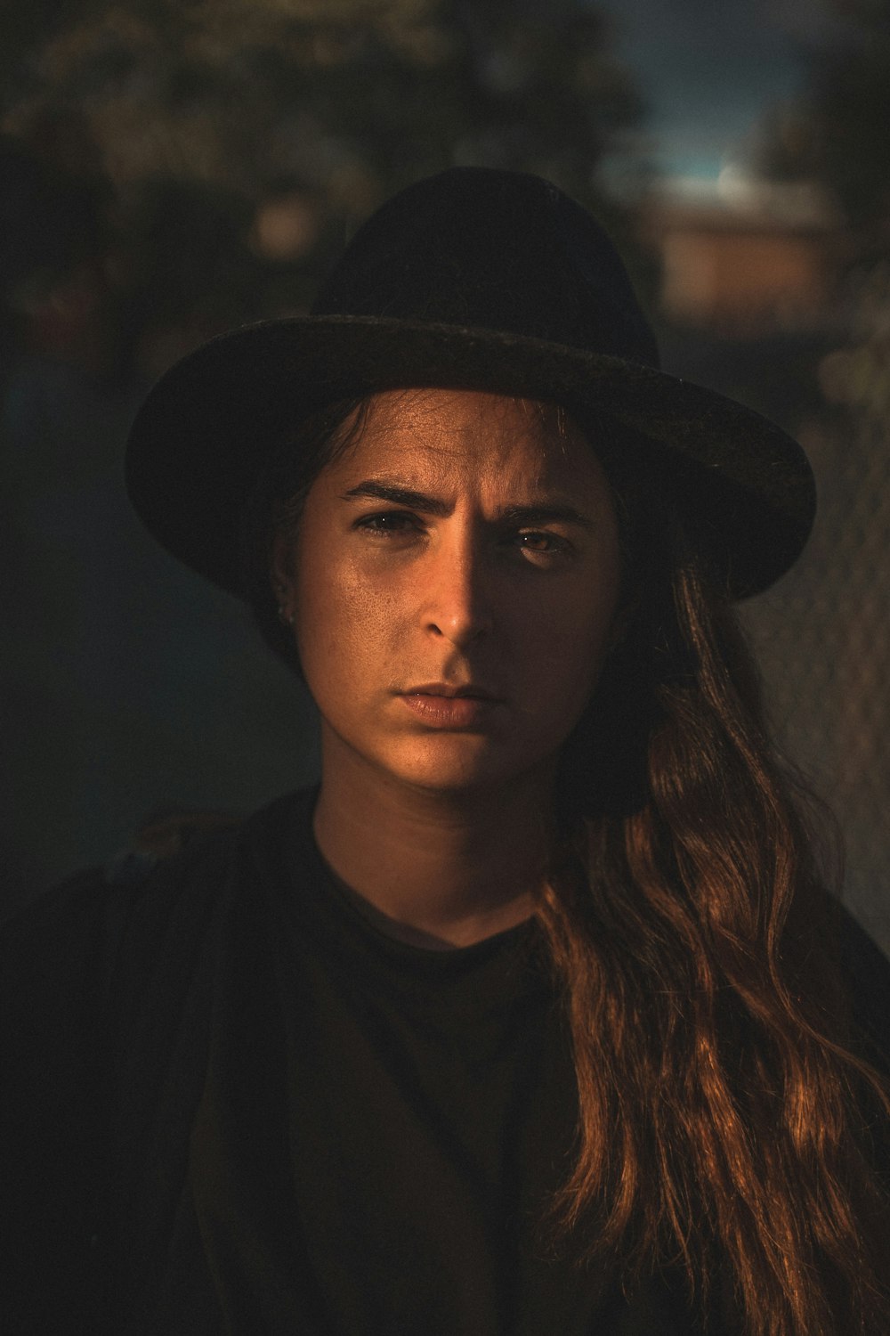 woman in black hat and black shirt