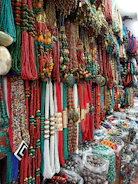 A colorful display of traditional tribal jewelry made from natural materials.