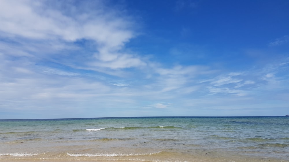 blue sky and white clouds over the sea