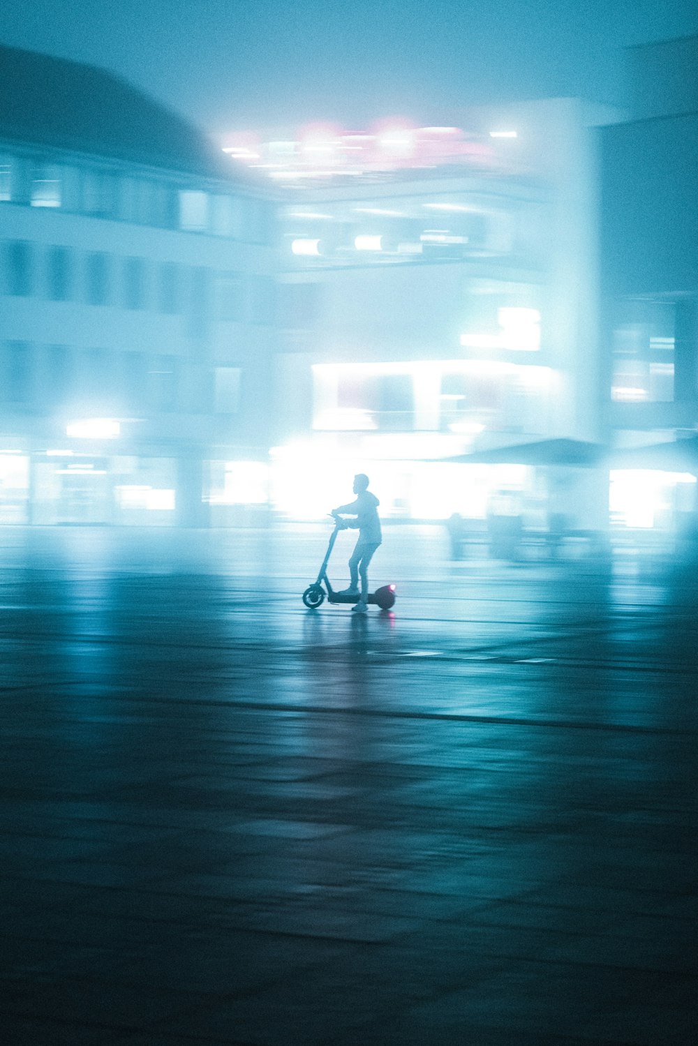 woman in white dress walking on street during night time