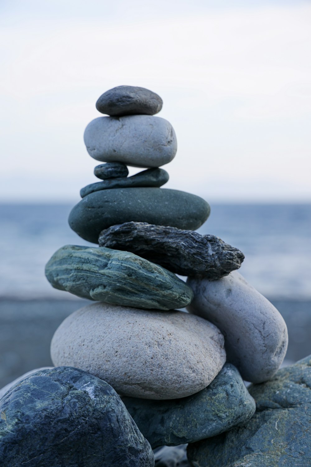 a stack of rocks sitting on top of a beach