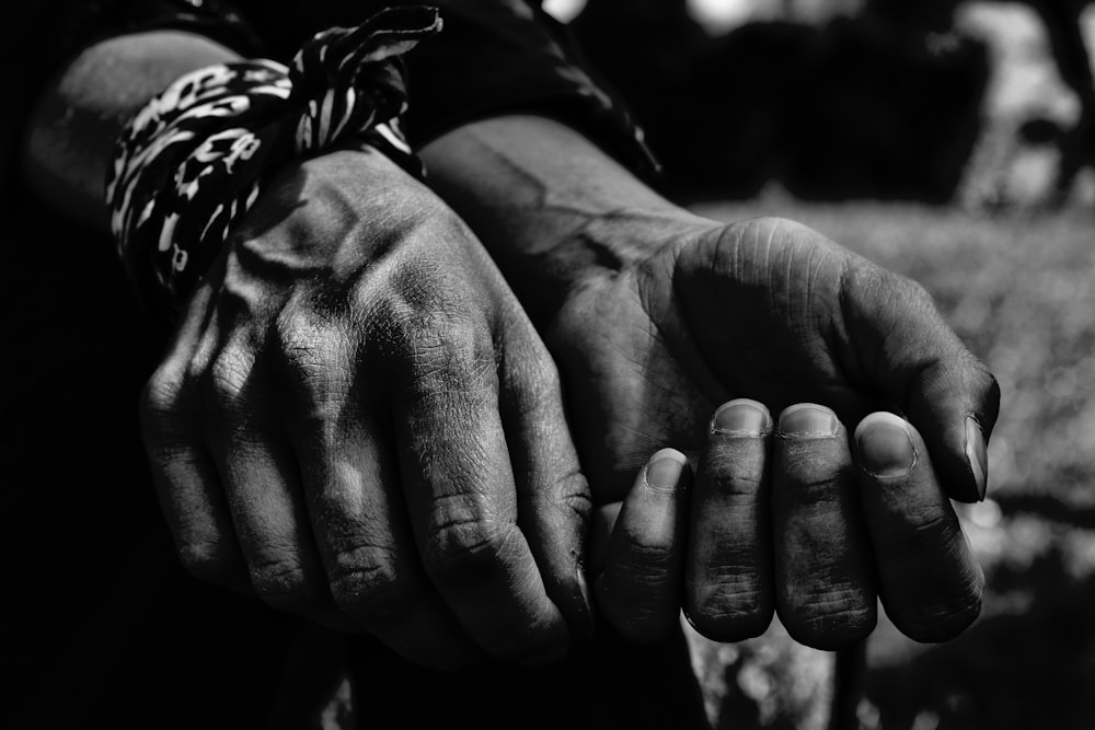 grayscale photo of persons hand