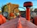 A red tractor is prominently featured in the foreground, with a round steering wheel centered above the body. On either side of the tractor, large circular headlights are visible. In the background, a stack of hay bales is decorated with pumpkins and corn stalks. A sign for 'Kat Acres Farm' is partially visible, adding an autumnal farm setting.