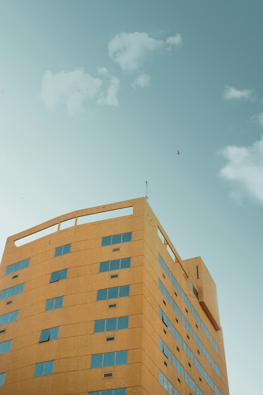 brown concrete building under blue sky during daytime