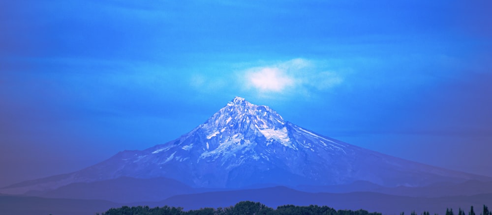 snow covered mountain under blue sky during daytime