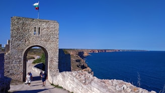 people walking on gray concrete bridge during daytime