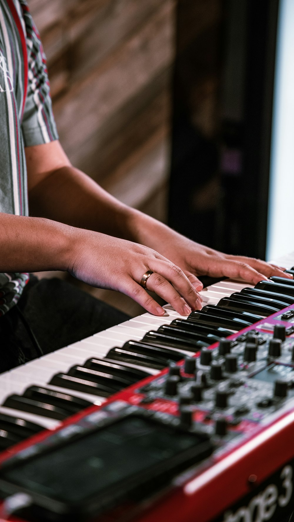 person playing piano in tilt shift lens