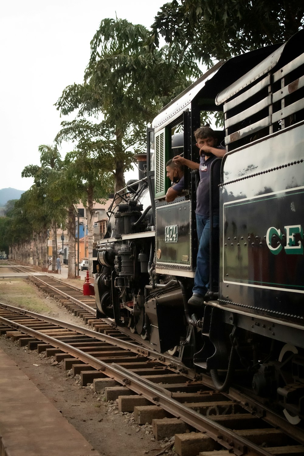 people riding on black train during daytime