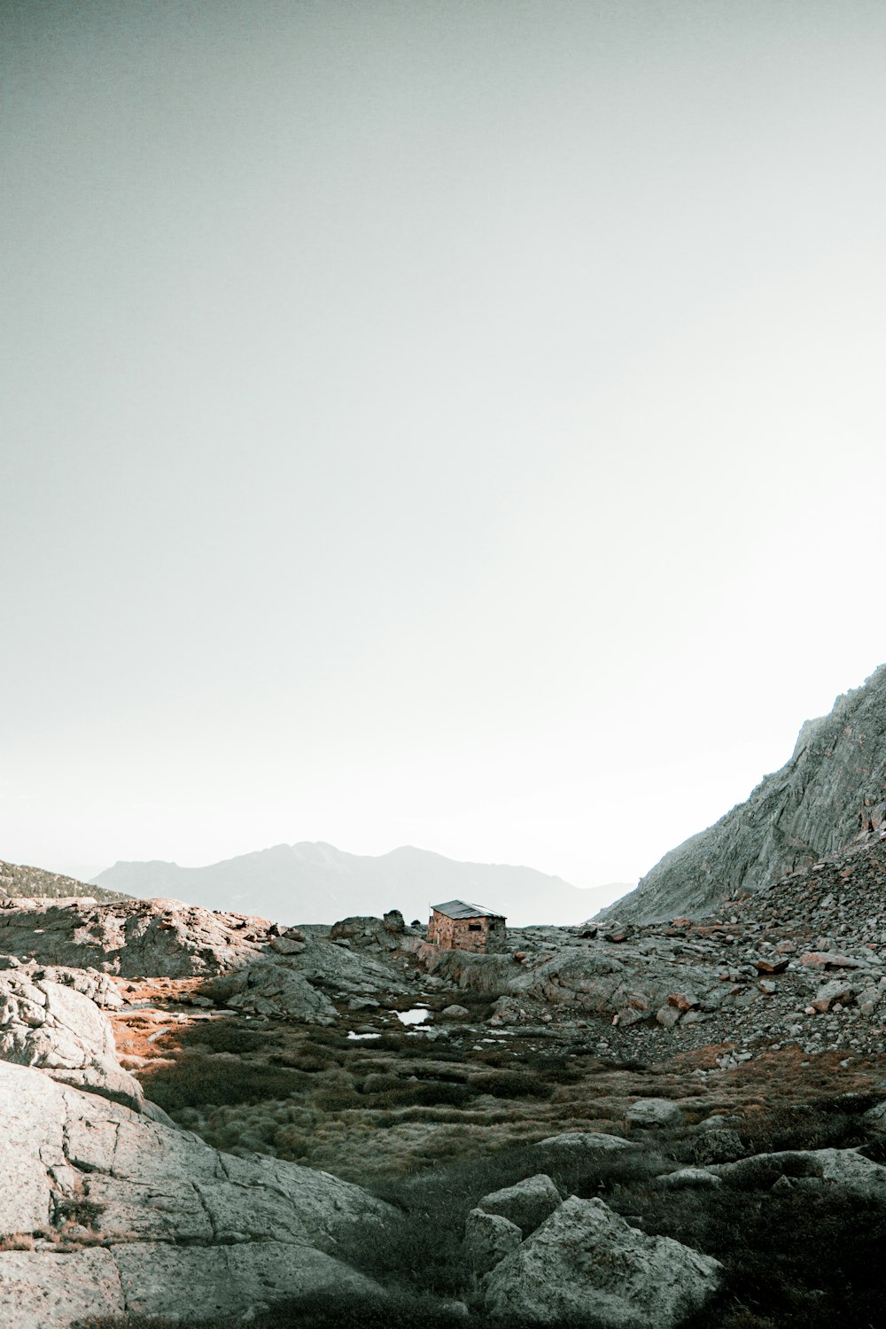 rocky mountain under white sky during daytime