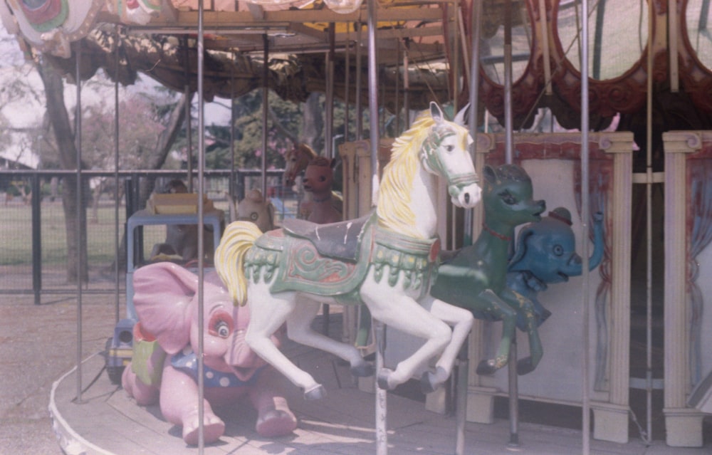 white and blue horse carousel