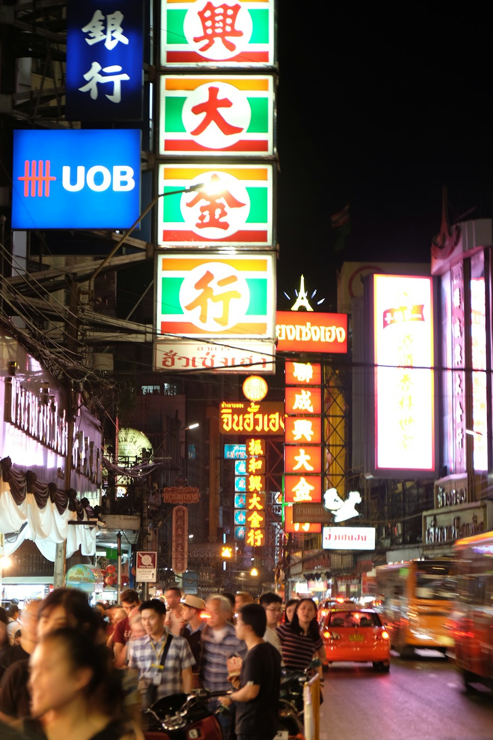 people walking on street during night time