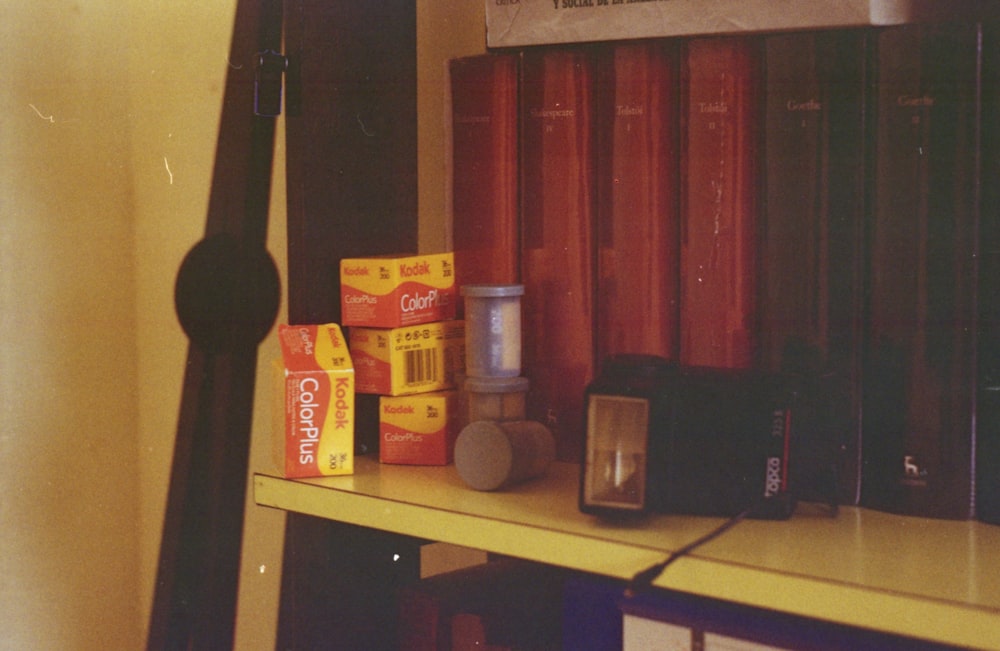 black speaker on brown wooden shelf