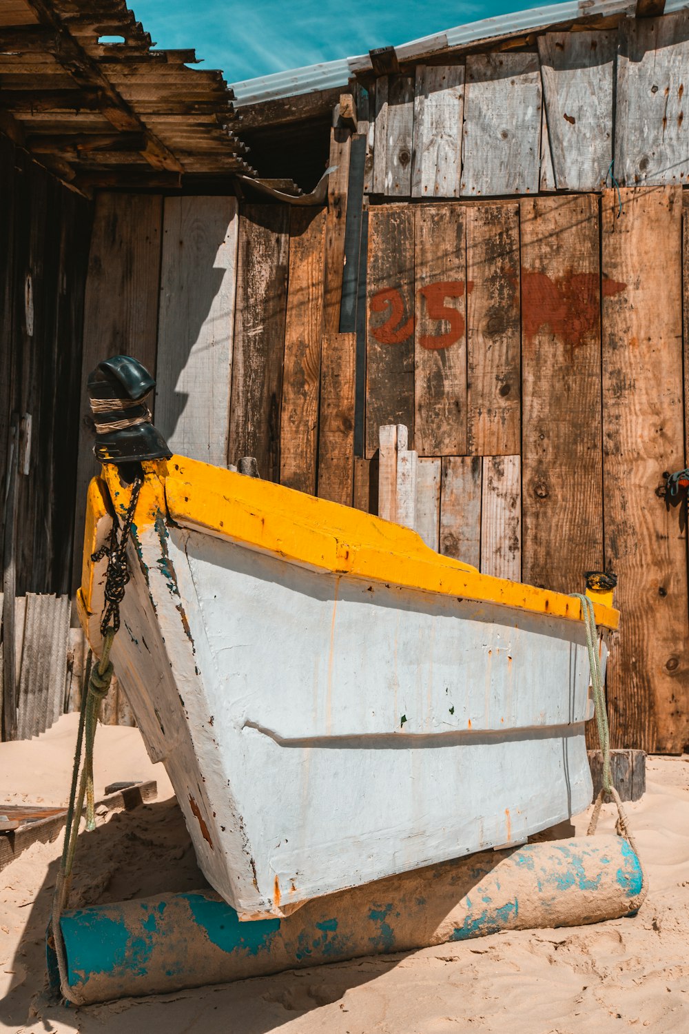 man in black helmet and black helmet on white and yellow boat