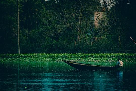 white boat on river during daytime in Berhampore India