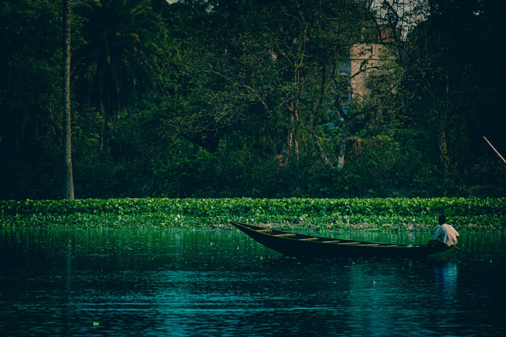 white boat on river during daytime