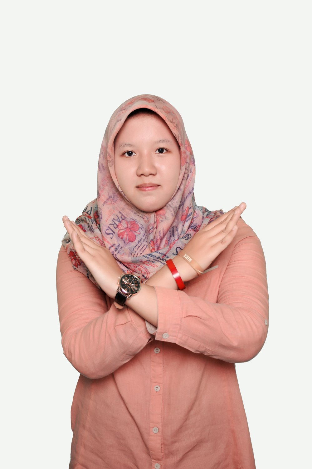 woman in pink hijab and silver ring