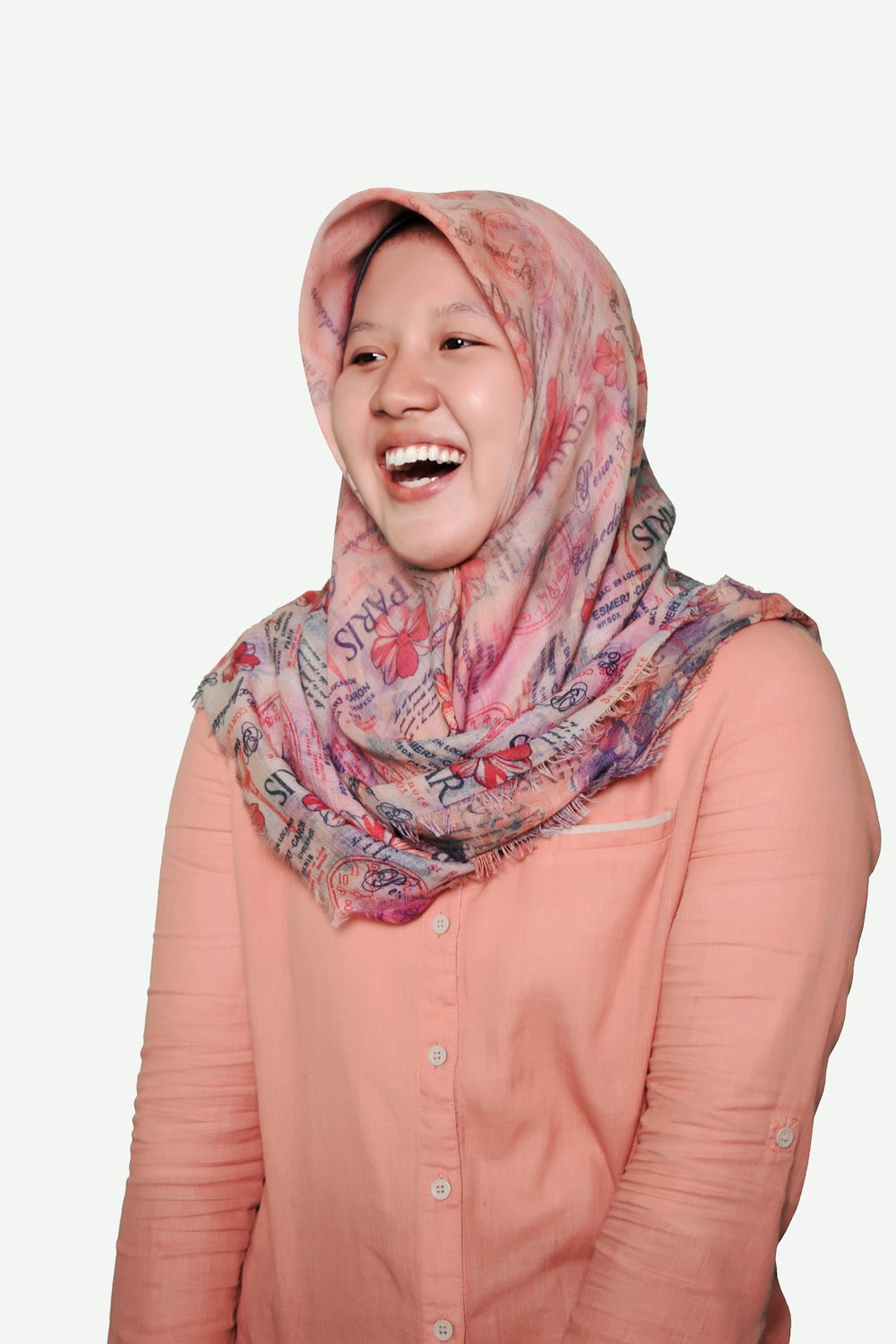 woman in pink long sleeve shirt wearing hijab