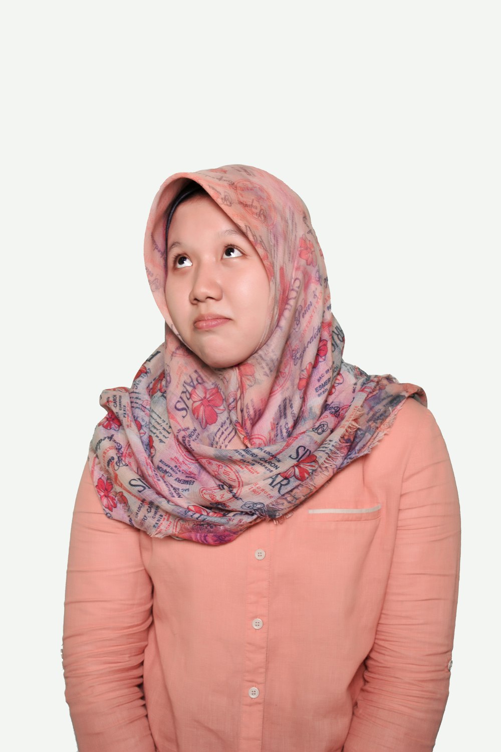 woman in pink button up long sleeve shirt wearing gray and white hijab
