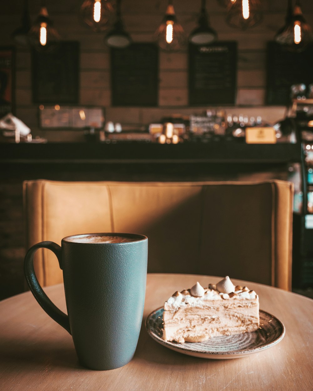 white ceramic mug on brown wooden table