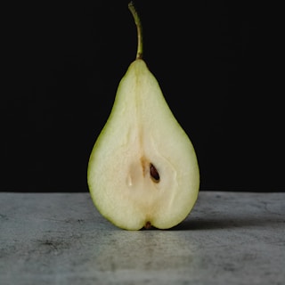 green fruit on gray wooden table