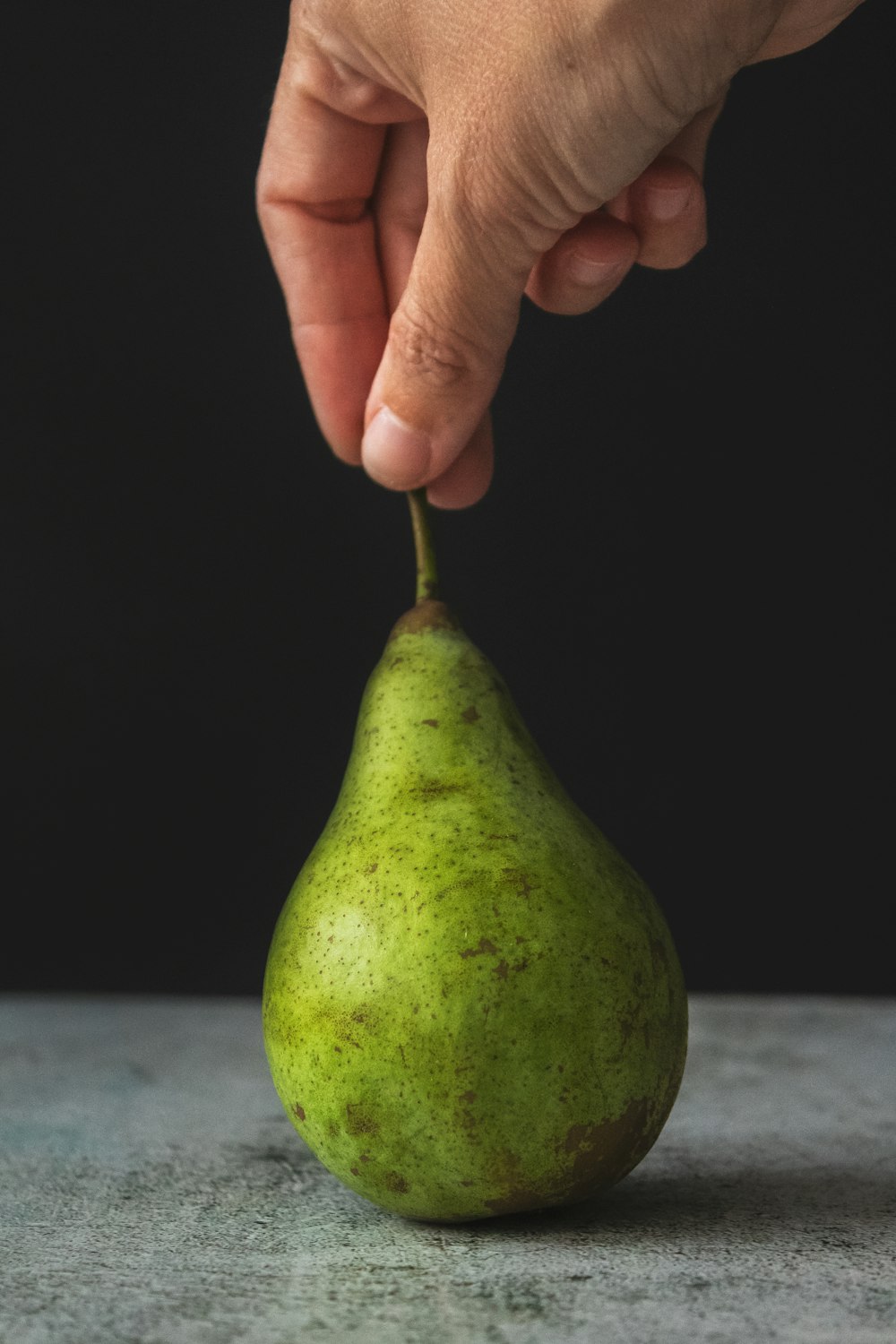 green fruit on white table