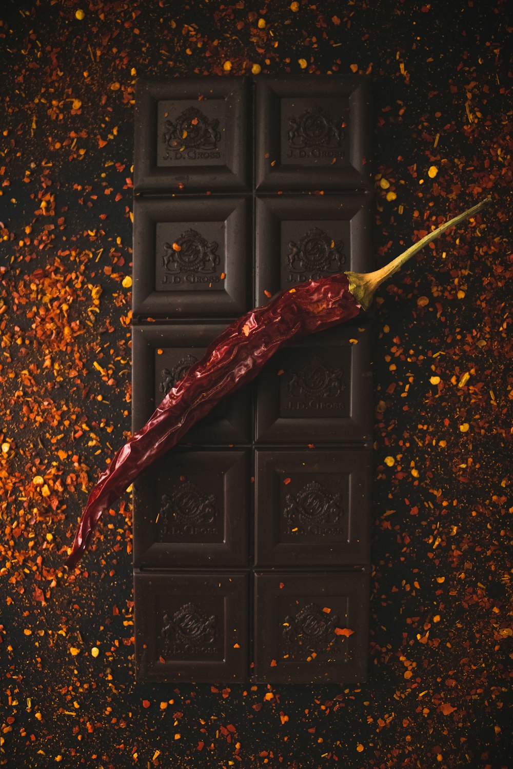 red and brown dried leaf on black wooden door