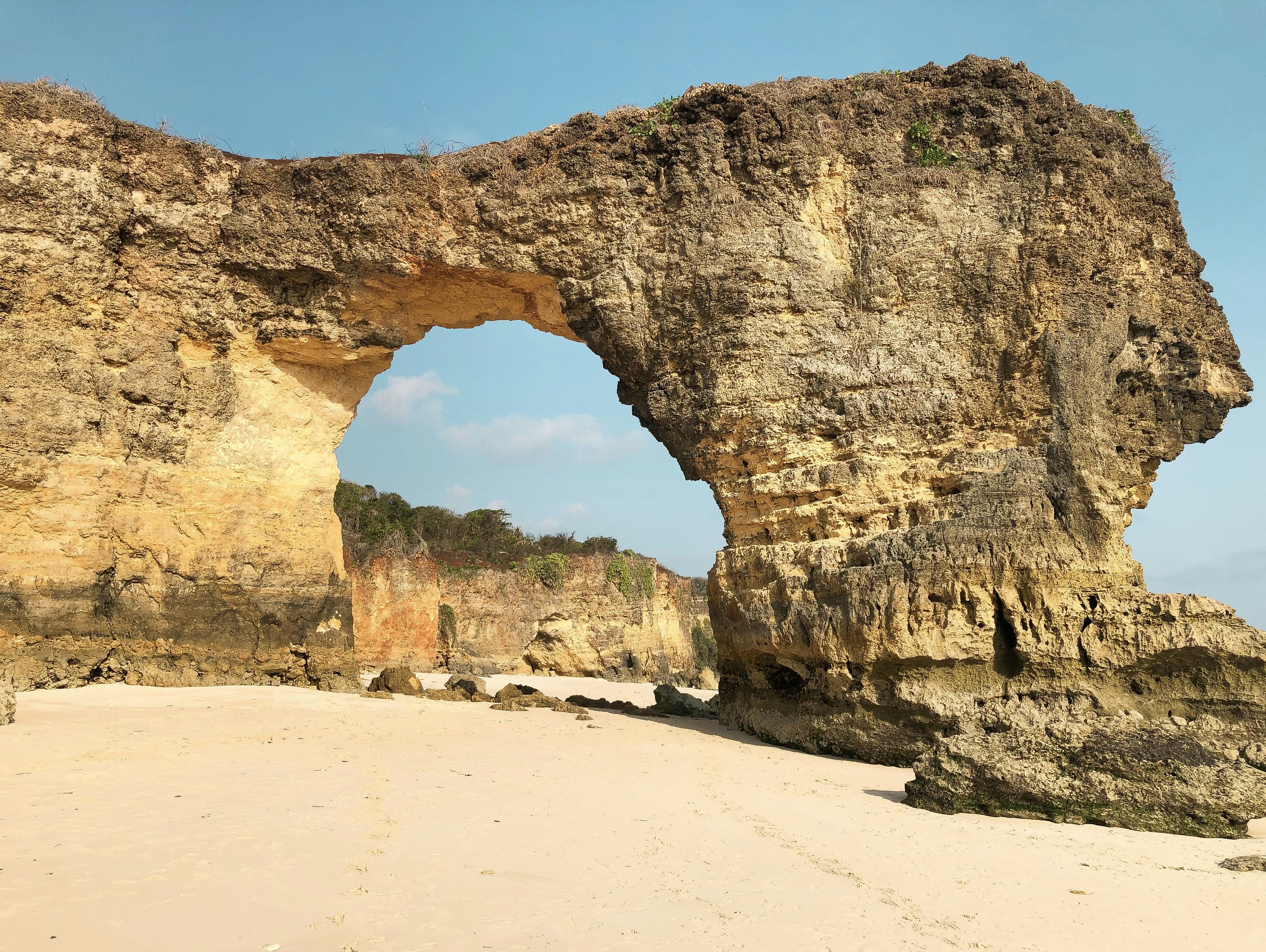brown rock formation under blue sky during daytime
