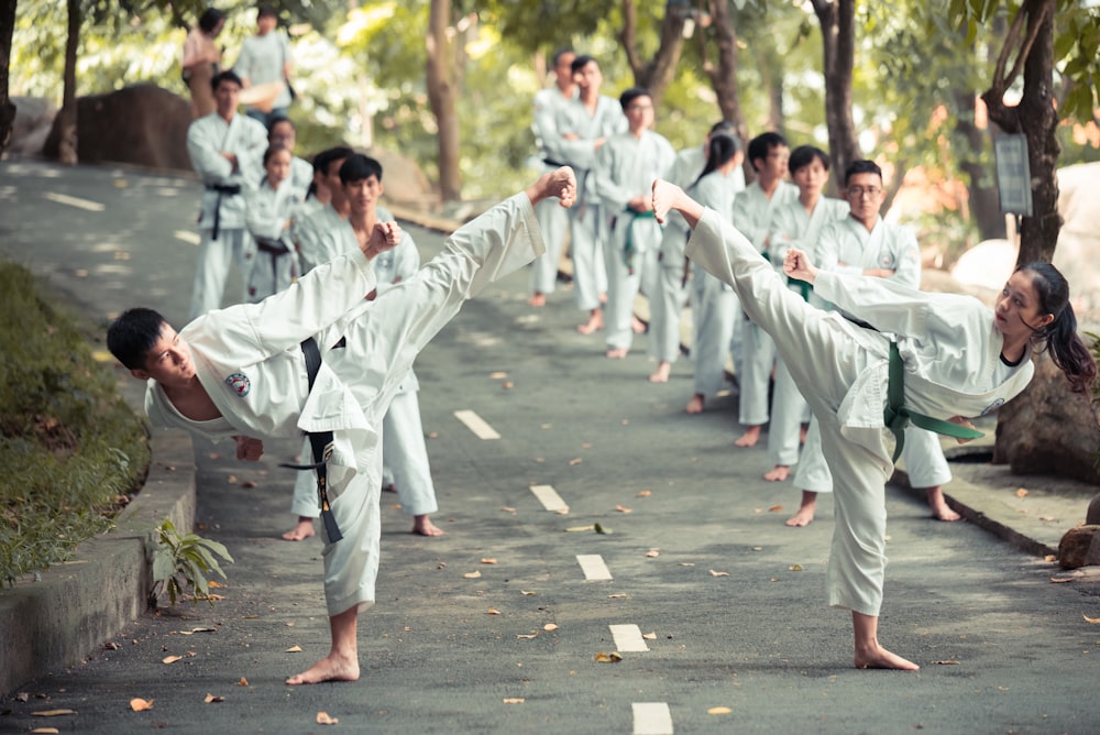 people in white robe walking on street during daytime