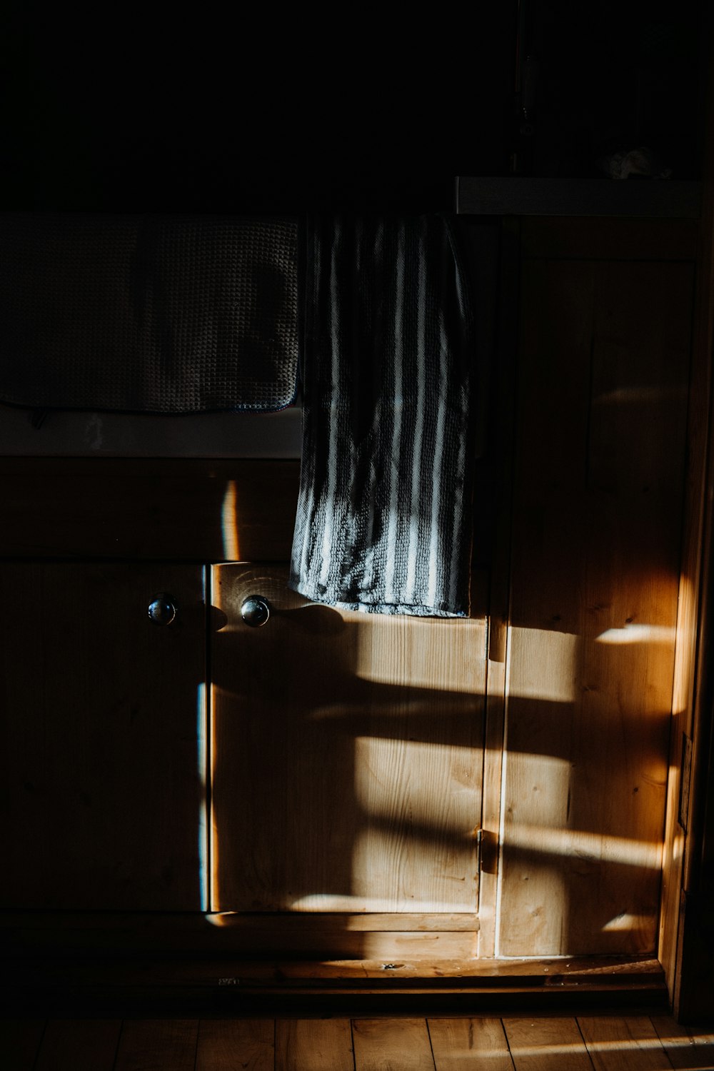 brown wooden door with silver door lever