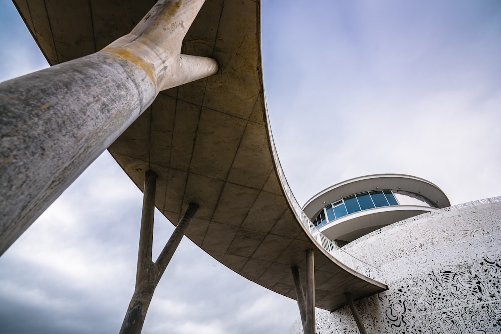 gray concrete building under white clouds during daytime