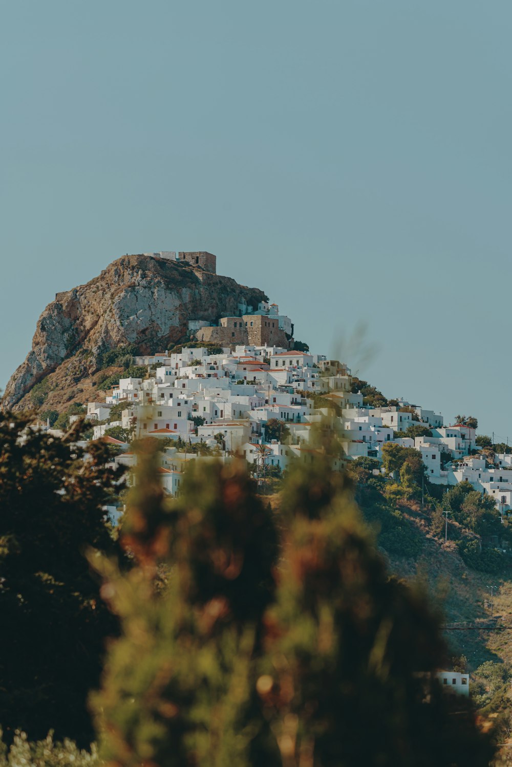 white and brown concrete building on top of mountain