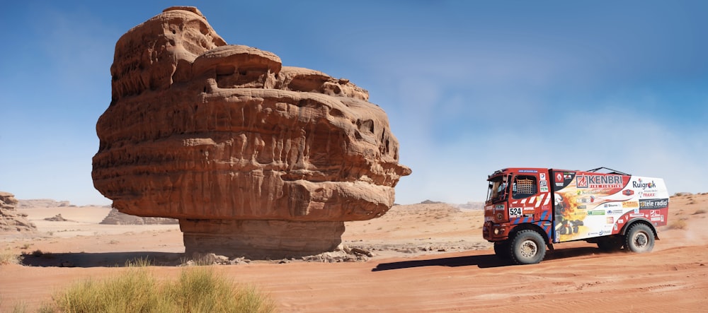 red and black car on brown sand during daytime