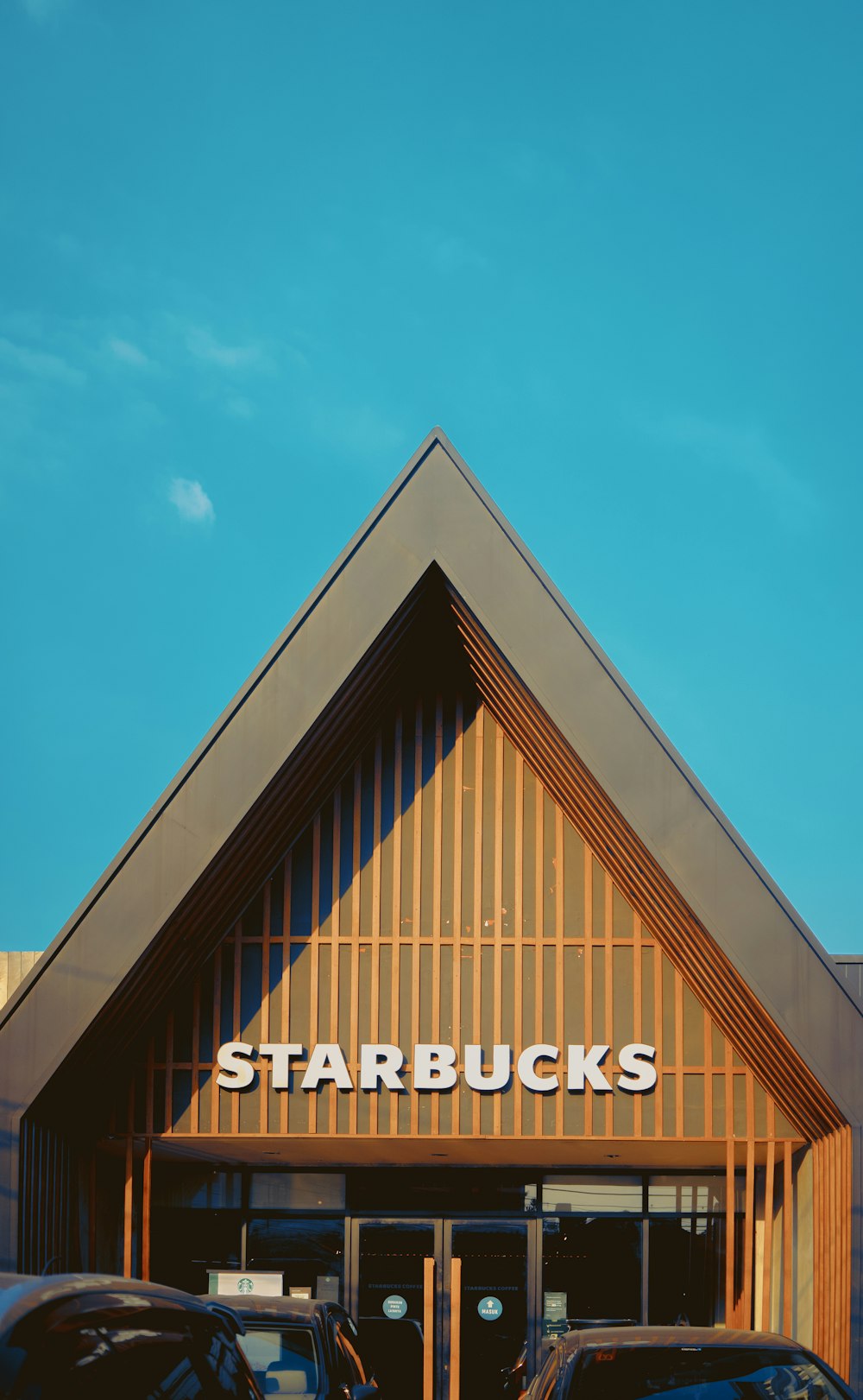 brown and white UNKs building under blue sky during daytime