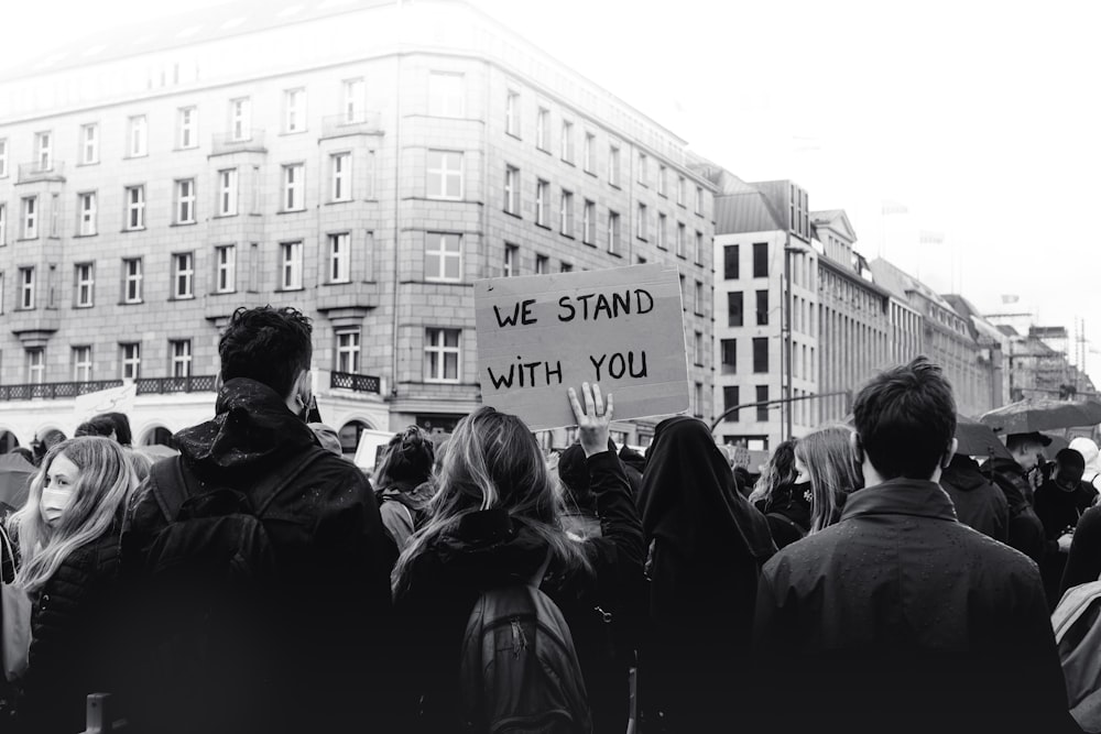 grayscale photo of people walking on street