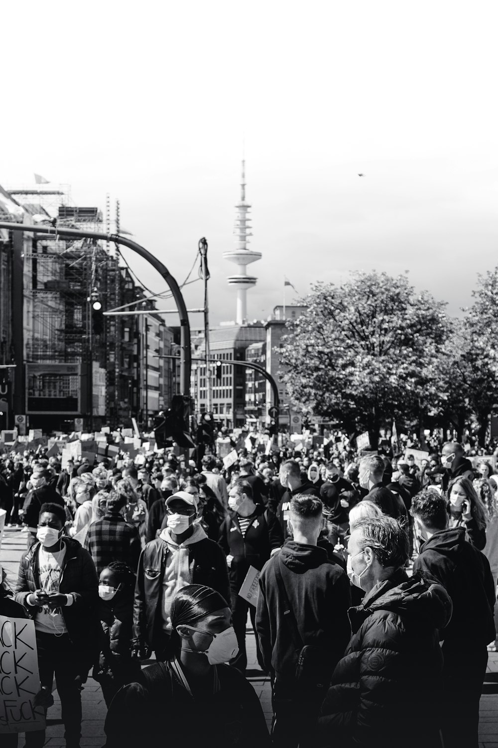 grayscale photo of people in the street