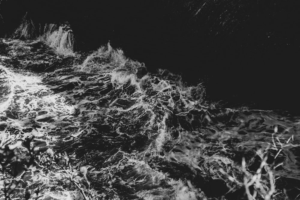 grayscale photo of water splash