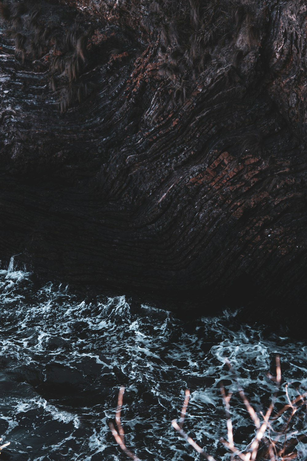 brown rock formation with white snow