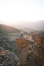 Close-up of a thoughtful Idaho resident looking out over a valley at sunset.